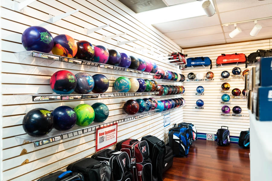 Bowling balls for sale on wall