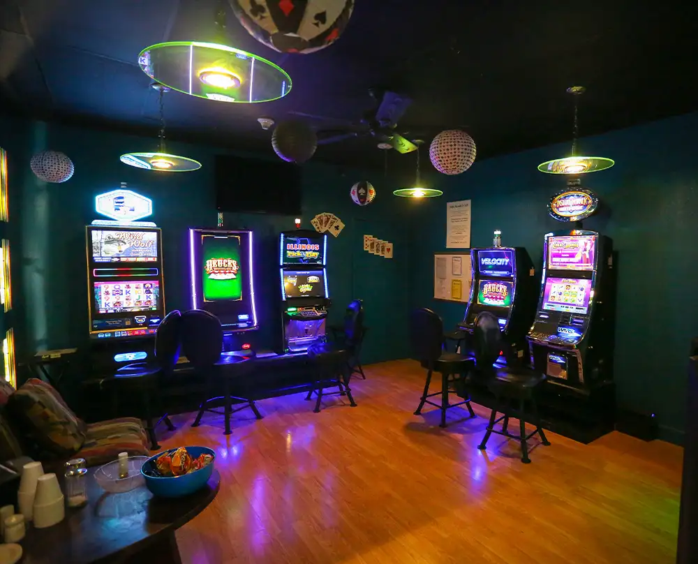 Customer playing a slot-style video gaming machine in Lucky's Gaming Lounge at Bel-Air Bowl in Belleville, IL